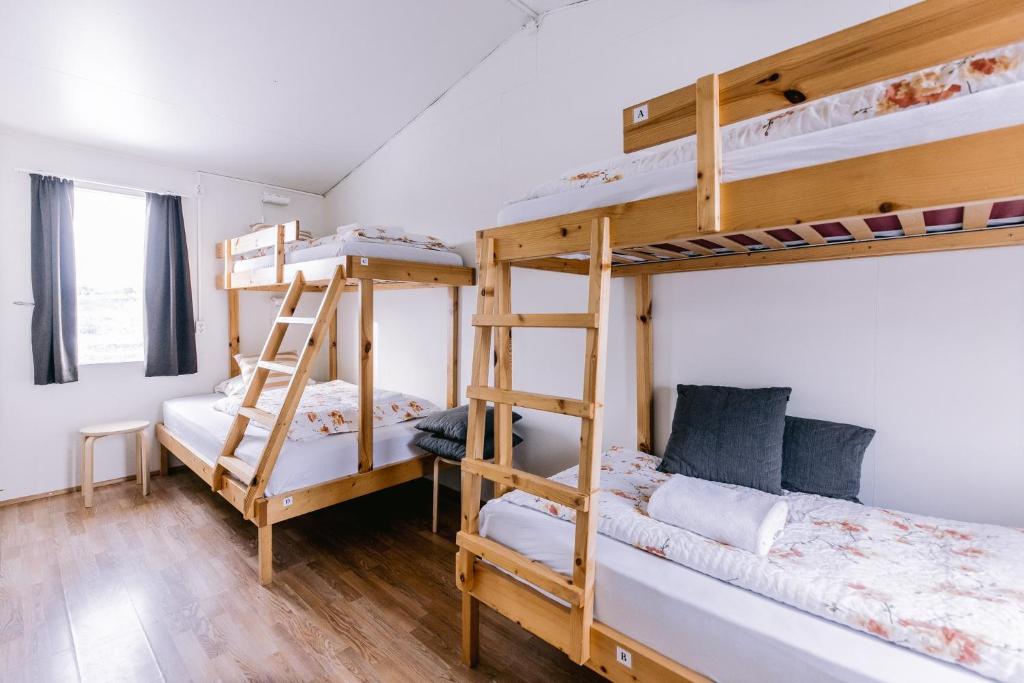 Postel nebo postele na pokoji v ubytování Hlid Hostel