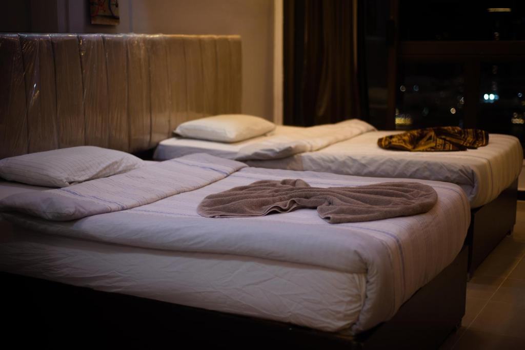 Postel nebo postele na pokoji v ubytování Nile sky hotel and suites