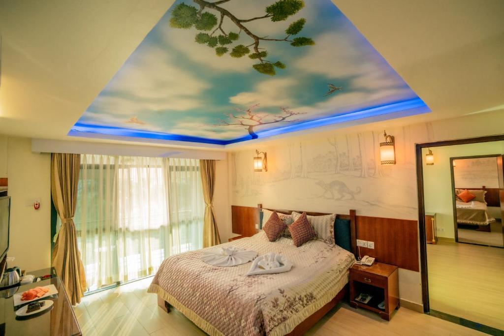 Postel nebo postele na pokoji v ubytování Hotel Jungle Crown