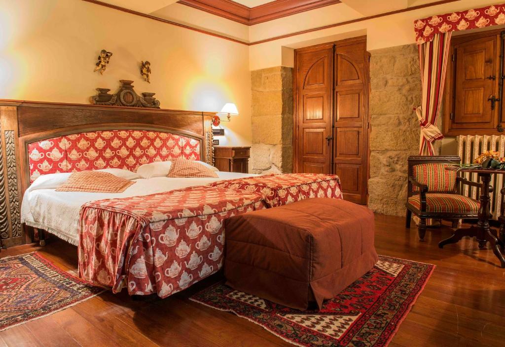 Cama o camas de una habitación en Hotel Castillo El Collado