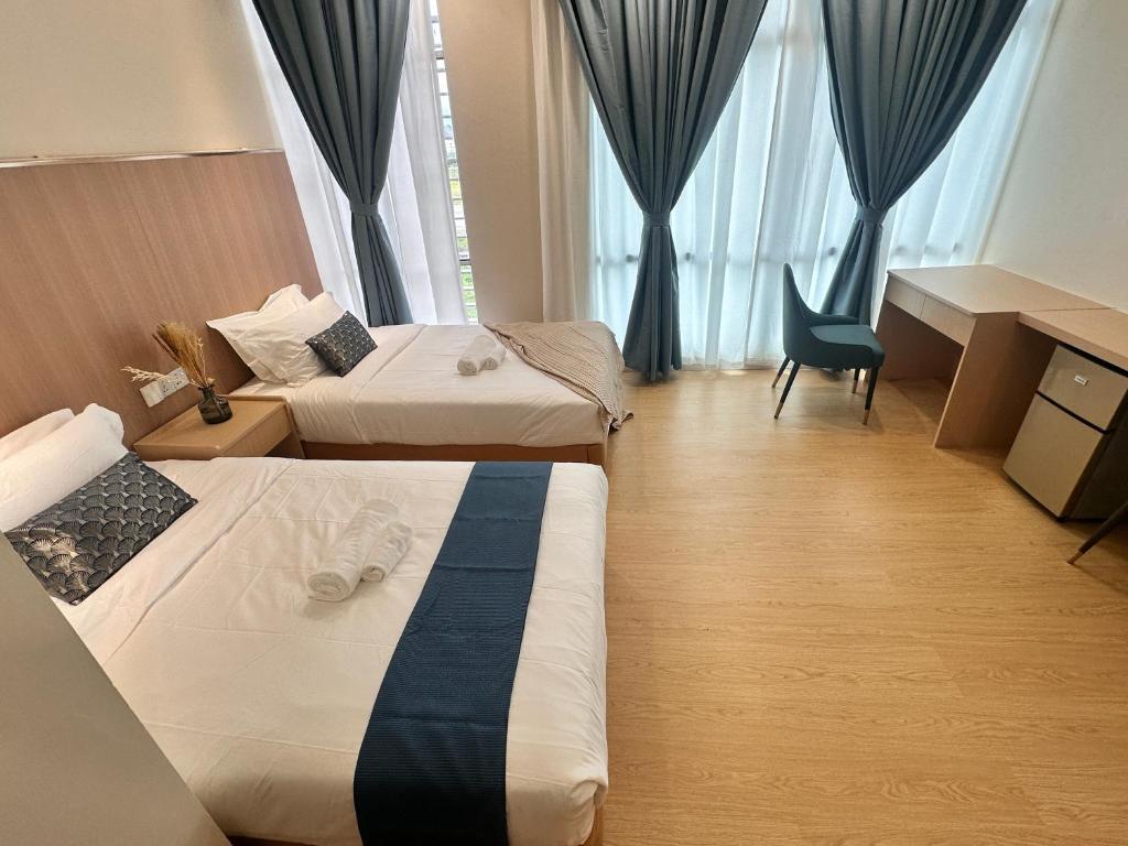 Postel nebo postele na pokoji v ubytování Mizu Homestay at KK Times Square by R2