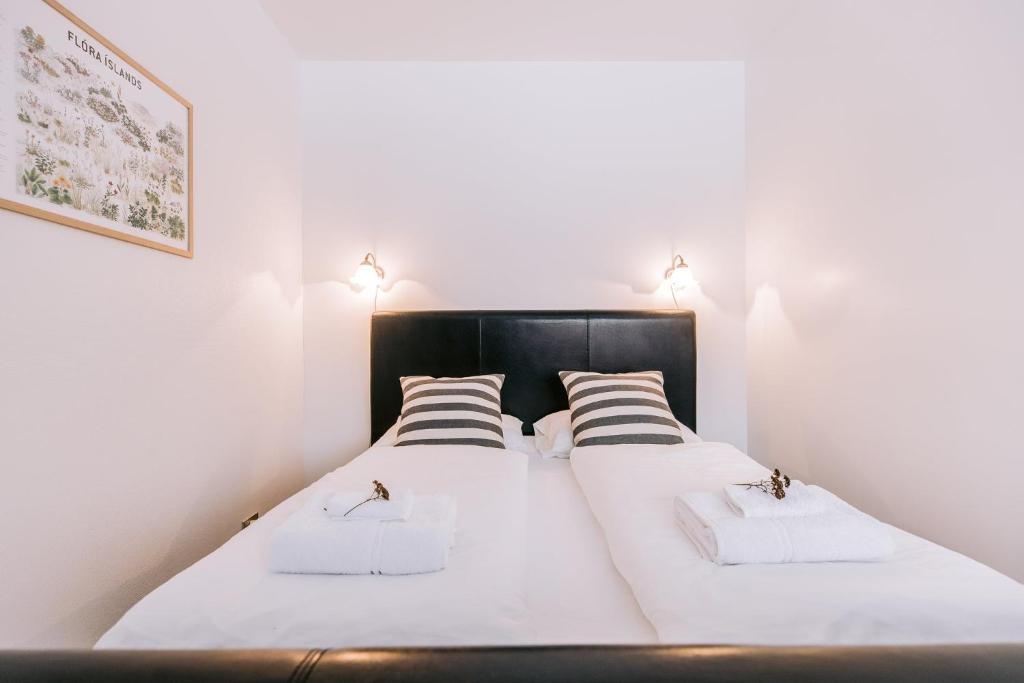 Postel nebo postele na pokoji v ubytování Eldá apartments