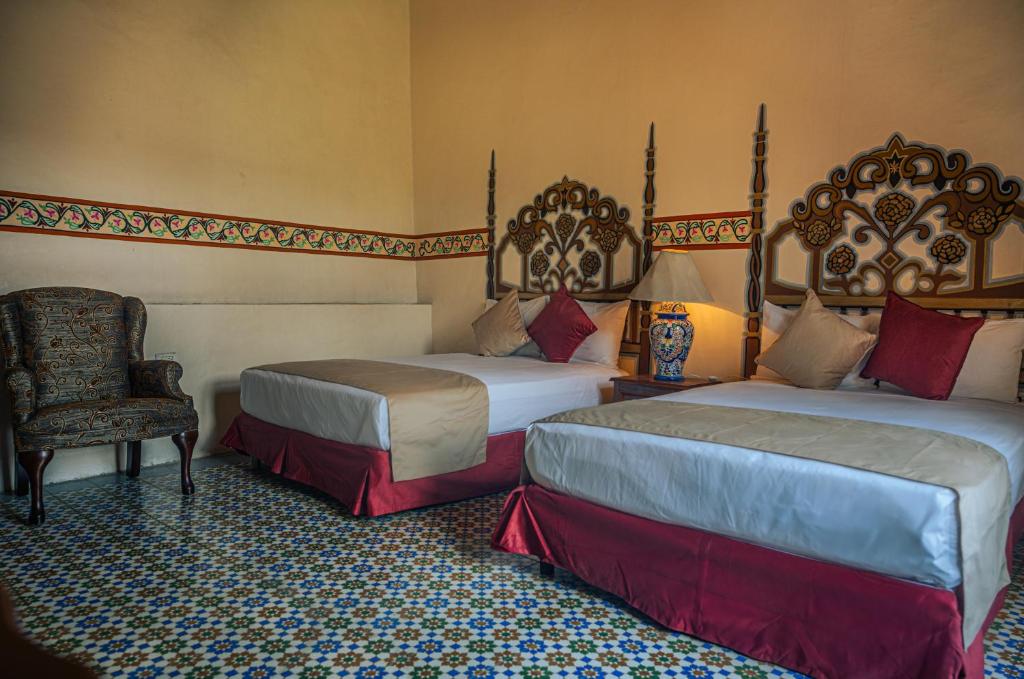Postel nebo postele na pokoji v ubytování Hotel Montecillo