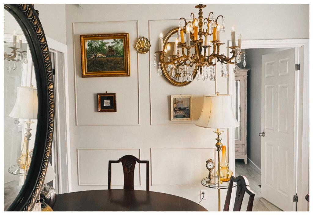 a dining room with a table and a mirror at The Stays - Private Cozy 2BHR Apt on main floor in Toronto