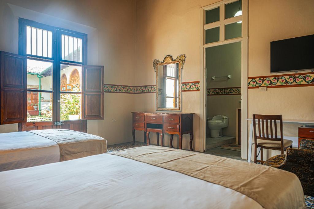 Postel nebo postele na pokoji v ubytování Hotel Montecillo