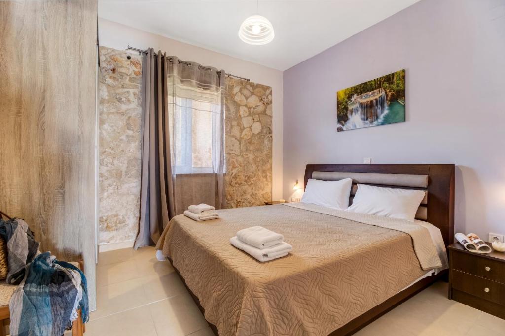 Ένα ή περισσότερα κρεβάτια σε δωμάτιο στο Gkountis stone apartment 4