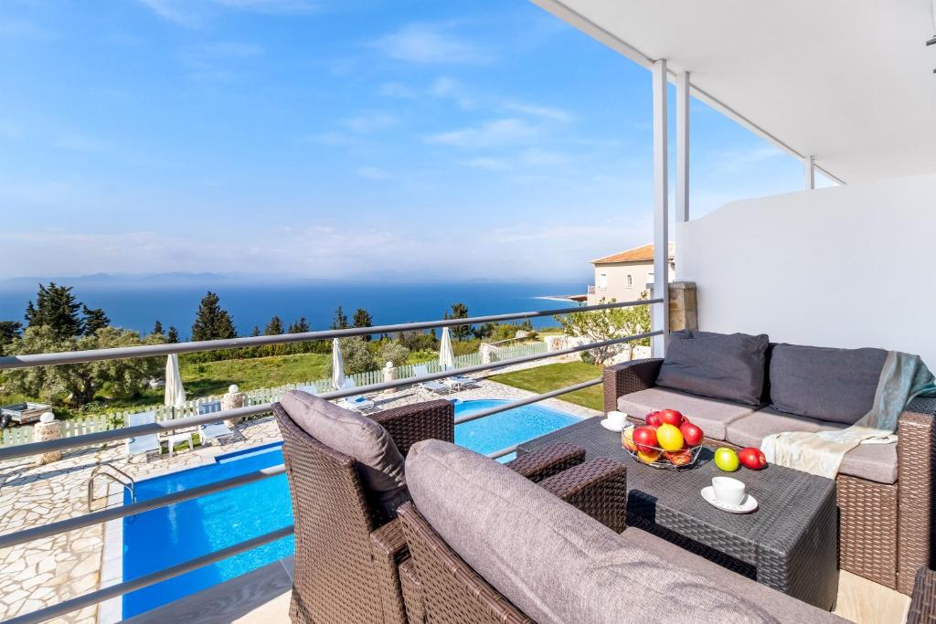 a villa with a view of the ocean at Gkountis deluxe apartment in Tsoukaladhes