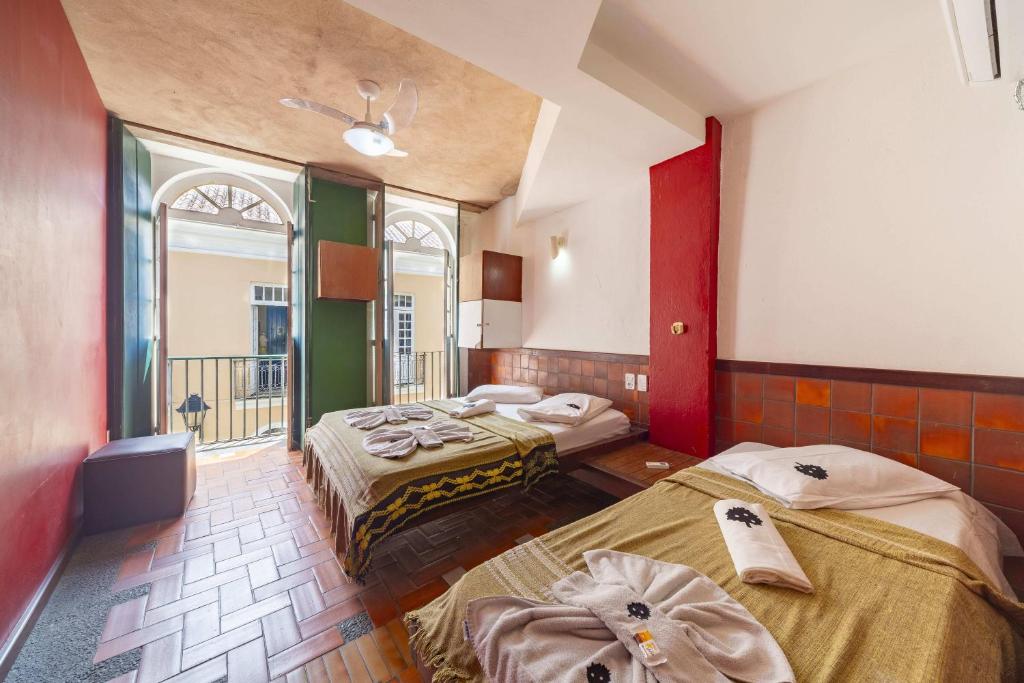 Postel nebo postele na pokoji v ubytování Laranjeiras Hostel