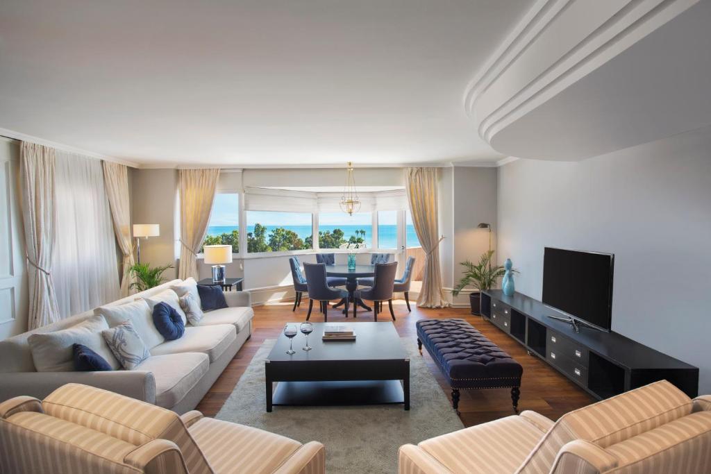 a living room with a couch and a table at IC Hotels Santai Family Resort - Kids Concept in Belek