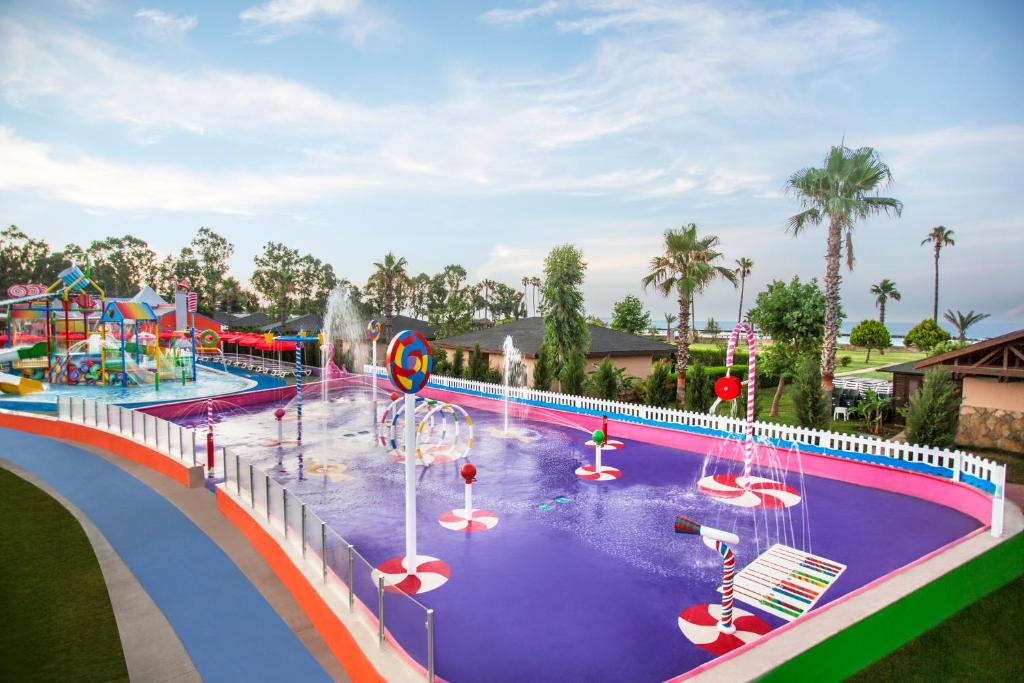 a pool at a water park with a water slide at IC Hotels Santai Family Resort - Kids Concept in Belek