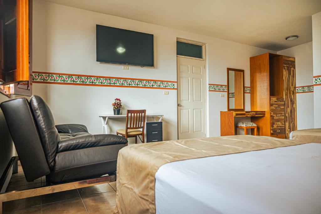 Postel nebo postele na pokoji v ubytování Hotel Montecillo
