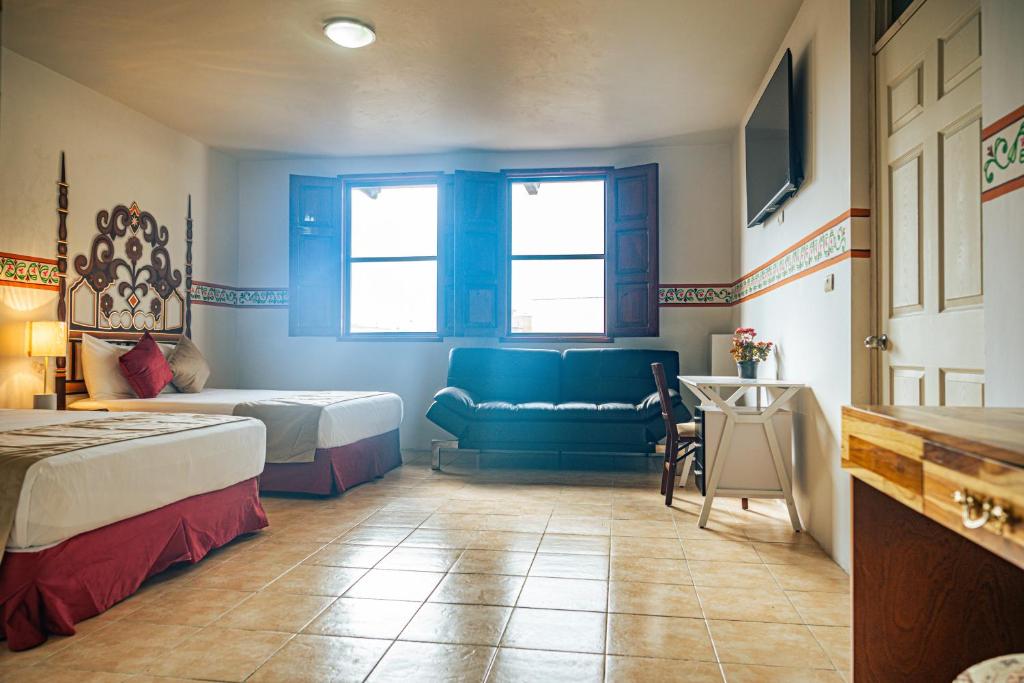 Postel nebo postele na pokoji v ubytování Hotel Montecillo