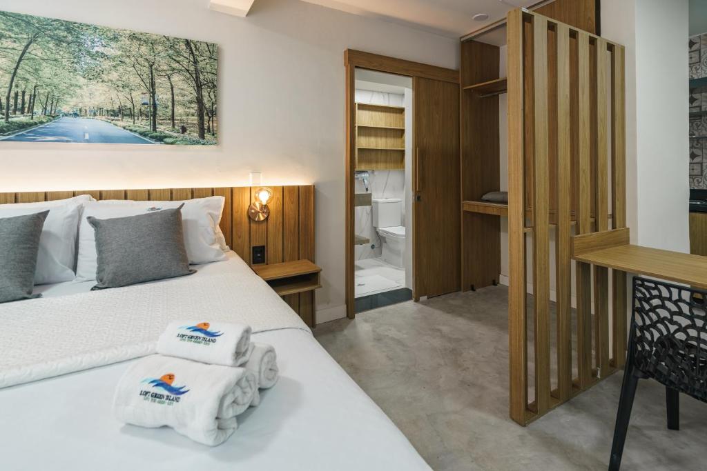 Postel nebo postele na pokoji v ubytování LOFTS GREEN ISLAND