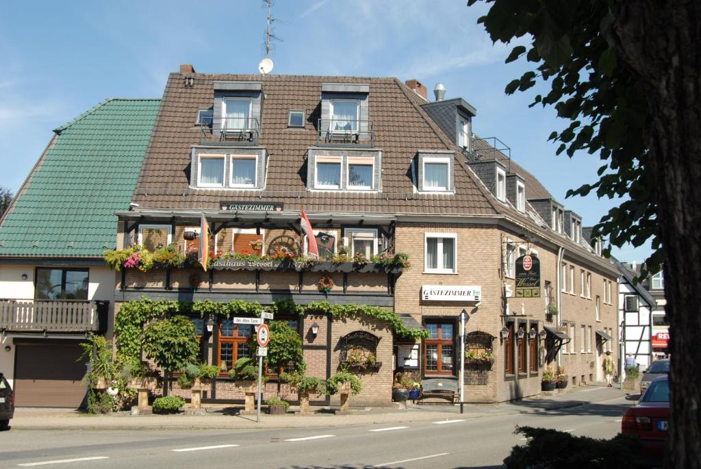 a building with flower boxes on the front of it at Haus Wessel in Cologne