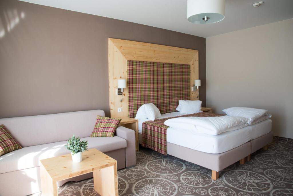 Postel nebo postele na pokoji v ubytování Boutique Hotel Erla