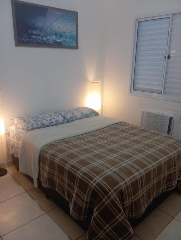 Postel nebo postele na pokoji v ubytování Quarto só meu