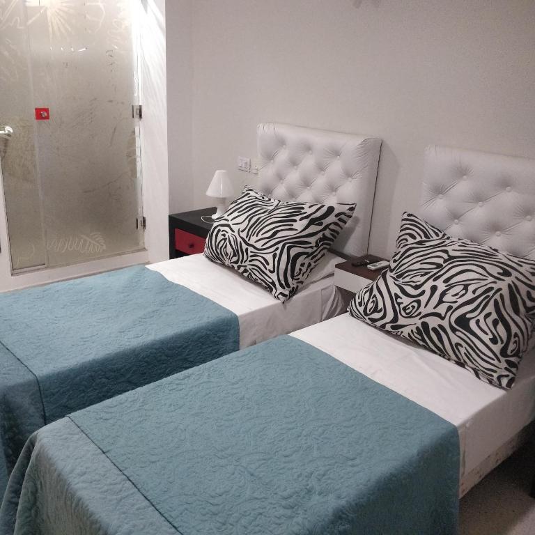 Postel nebo postele na pokoji v ubytování Rosa Ramona Rooms