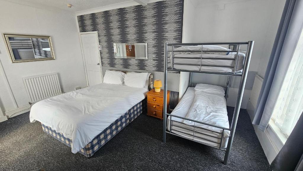 Postel nebo postele na pokoji v ubytování Bowies Lodge