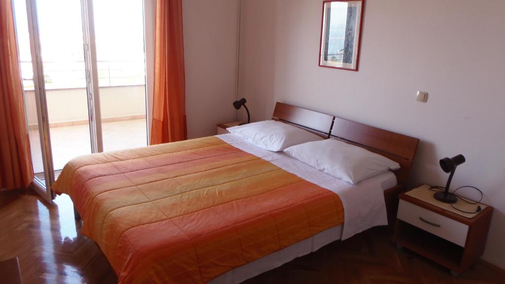 Łóżko lub łóżka w pokoju w obiekcie Apartment House Nono