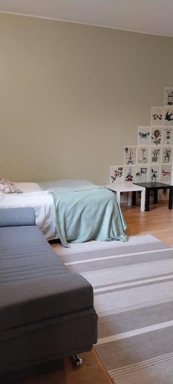 En eller flere senge i et værelse på Studio PP