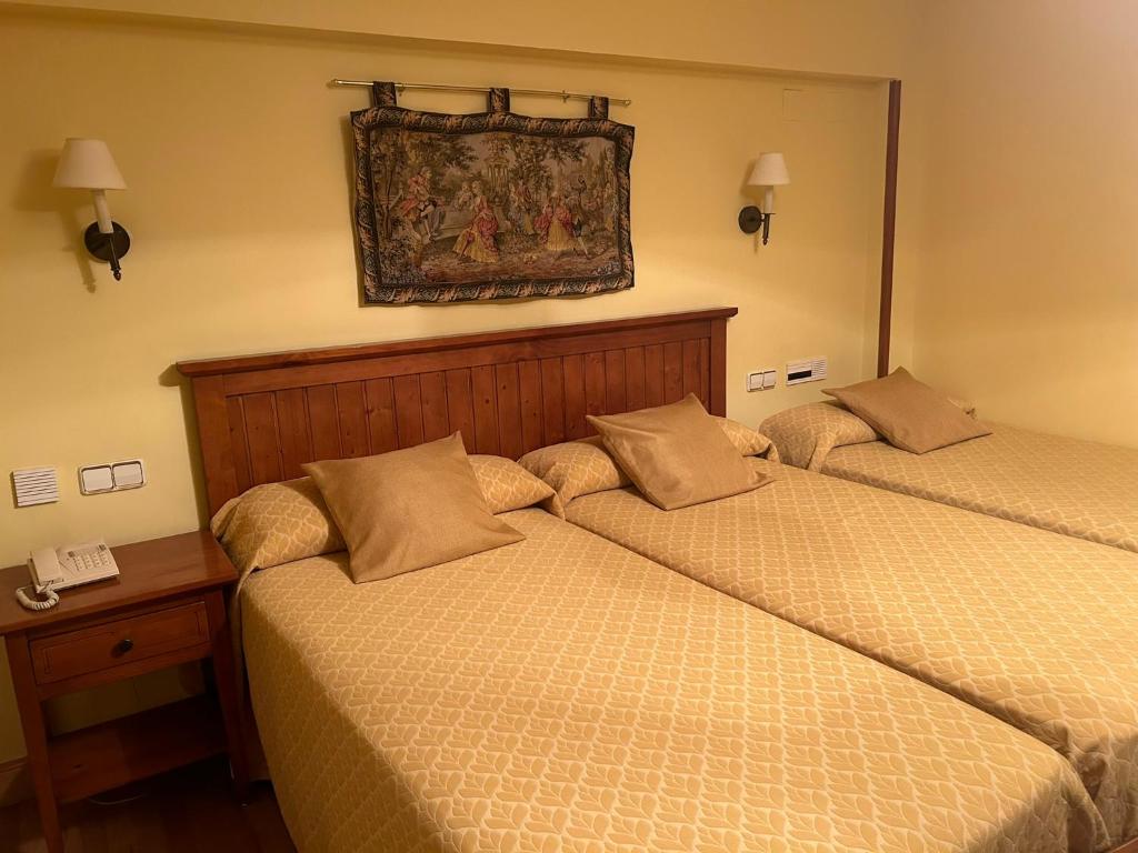 Postel nebo postele na pokoji v ubytování Hotel Casona de la Reyna