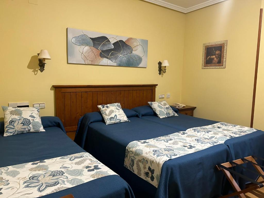 Postel nebo postele na pokoji v ubytování Hotel Casona de la Reyna