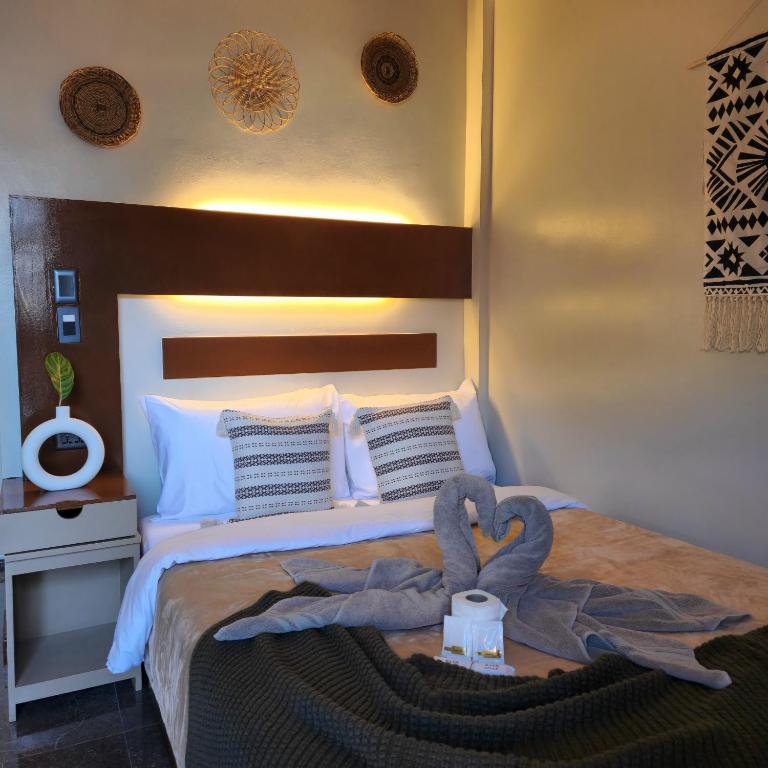 Postel nebo postele na pokoji v ubytování Inngo Tourist Inn
