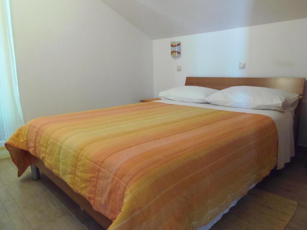 Łóżko lub łóżka w pokoju w obiekcie Apartment House Nono