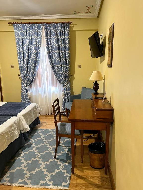 Postel nebo postele na pokoji v ubytování Hotel Casona de la Reyna