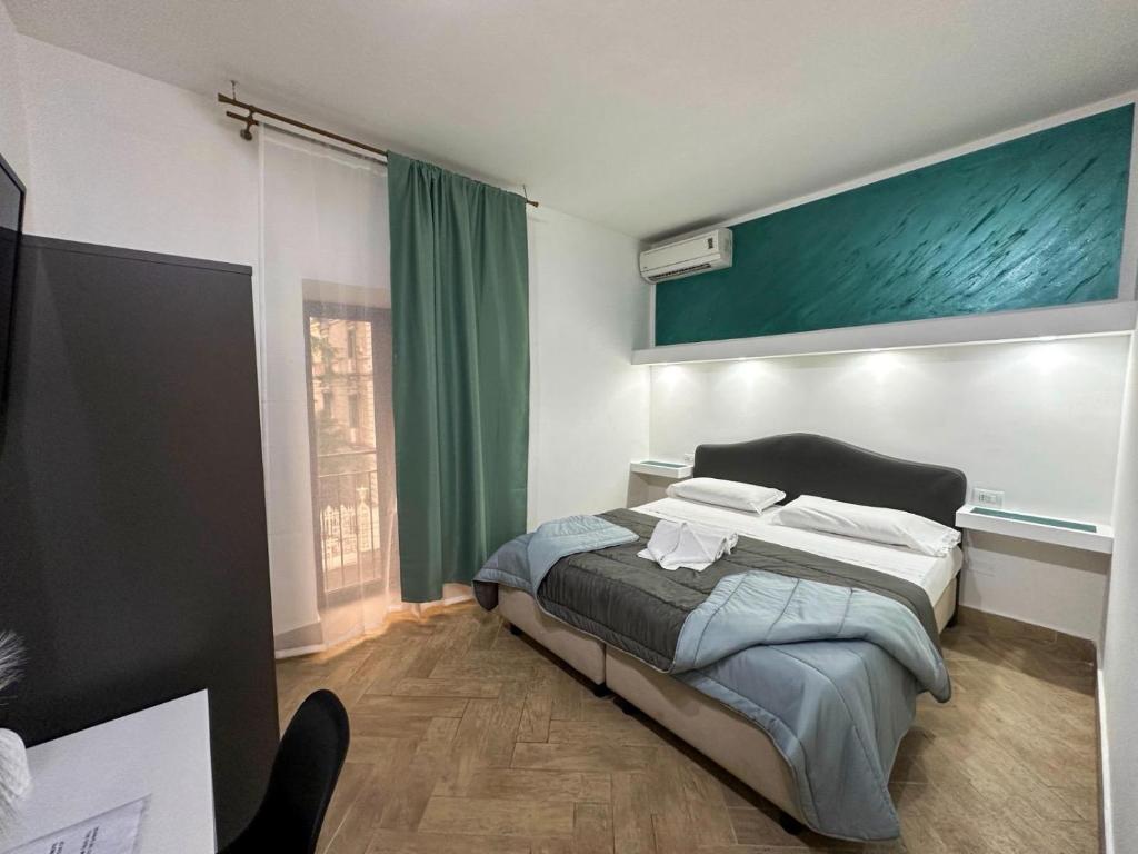 Postel nebo postele na pokoji v ubytování Hotel Barbato