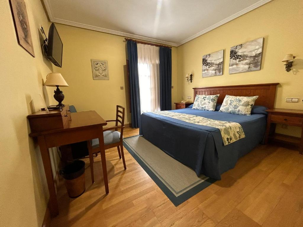 Postel nebo postele na pokoji v ubytování Hotel Casona de la Reyna