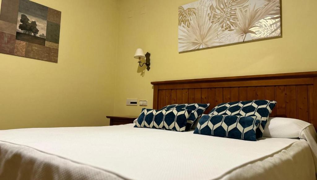 Postel nebo postele na pokoji v ubytování Hotel Casona de la Reyna