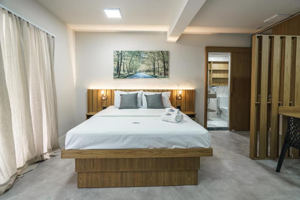 Postel nebo postele na pokoji v ubytování LOFTS GREEN ISLAND