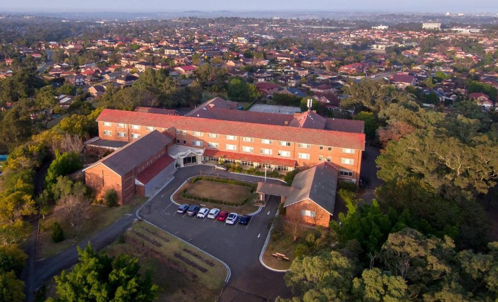 an overhead view of a building with a parking lot at Mary MacKillop Spirituality Centre Baulkham Hills in Baulkham Hills