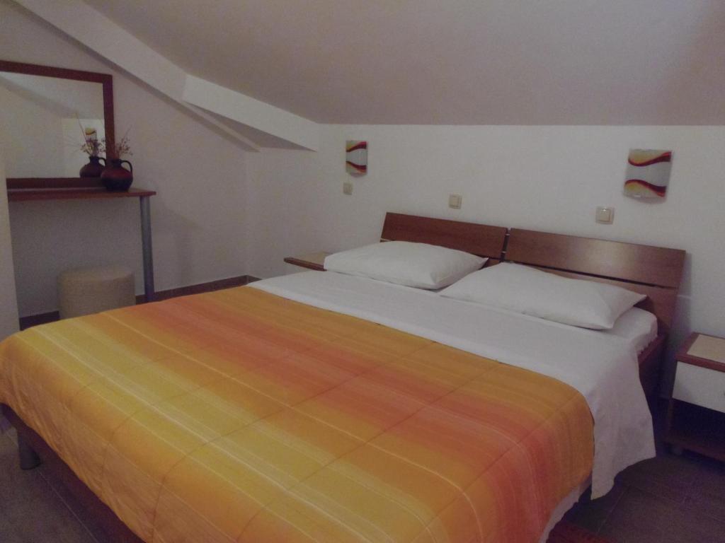 Łóżko lub łóżka w pokoju w obiekcie Apartment House Nono