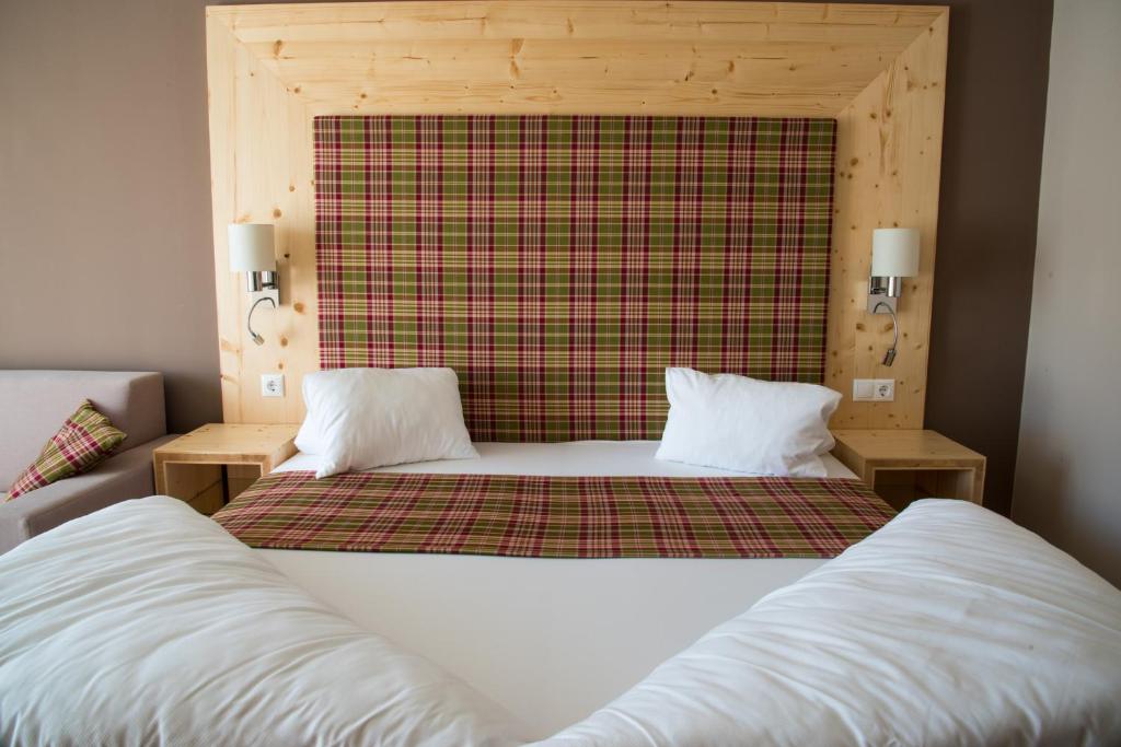 Postel nebo postele na pokoji v ubytování Boutique Hotel Erla