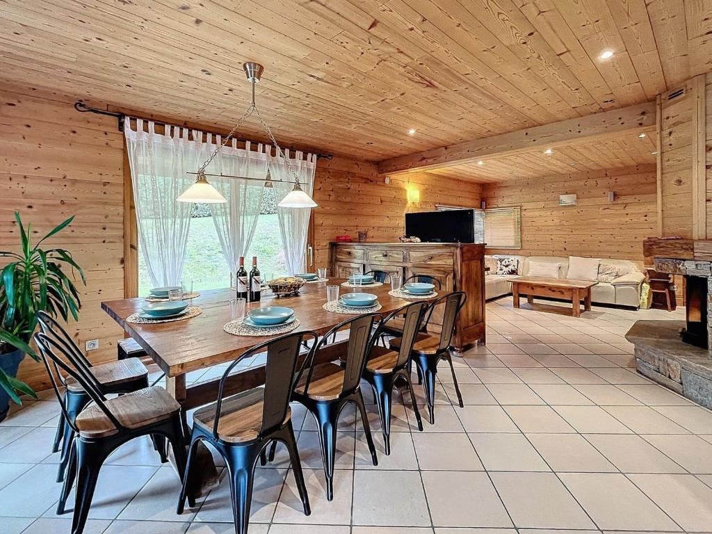 a large dining room with a table and chairs at Chalet Savage 170m² près des pistes, Wi-Fi, parking, matériel bébé - FR-1-267-299 in Villarembert