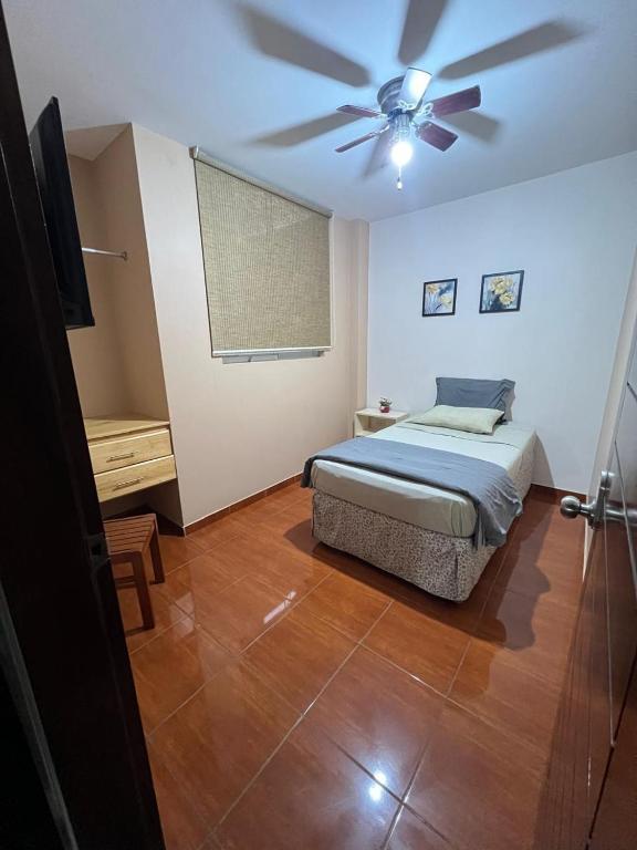 Postel nebo postele na pokoji v ubytování TruGarden Hotel Trujillo