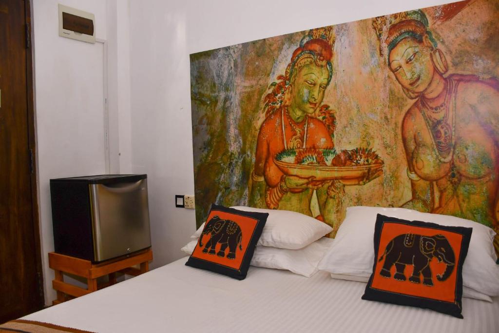 Postel nebo postele na pokoji v ubytování Hotel Gala Addara
