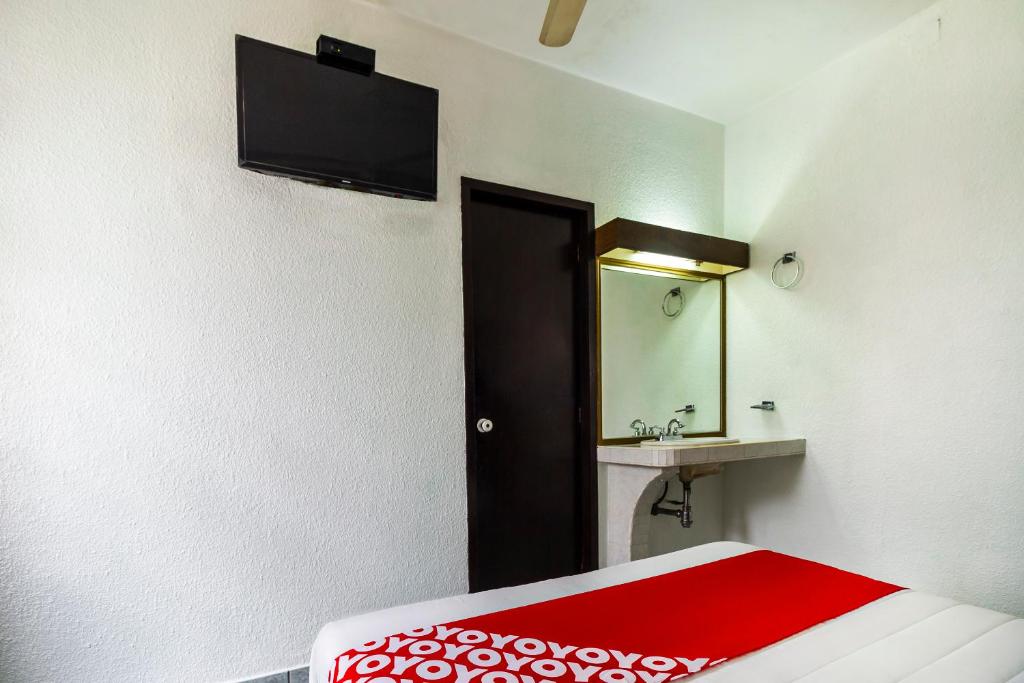 Postel nebo postele na pokoji v ubytování Hotel Canada, Guadalajara