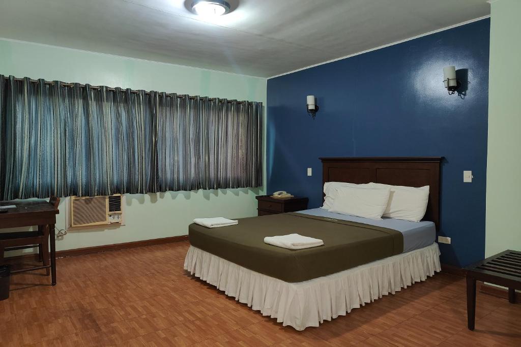 Postel nebo postele na pokoji v ubytování Oftana Suites Cebu near Oakridge