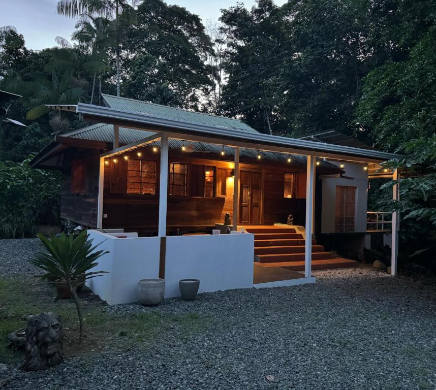 a house with lights on the front of it at Casa Luminosa jungle villa in Cocles