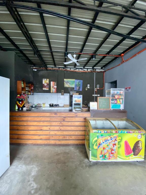 a fast food restaurant with a counter in a room at The Pocket Hotel in Mactan