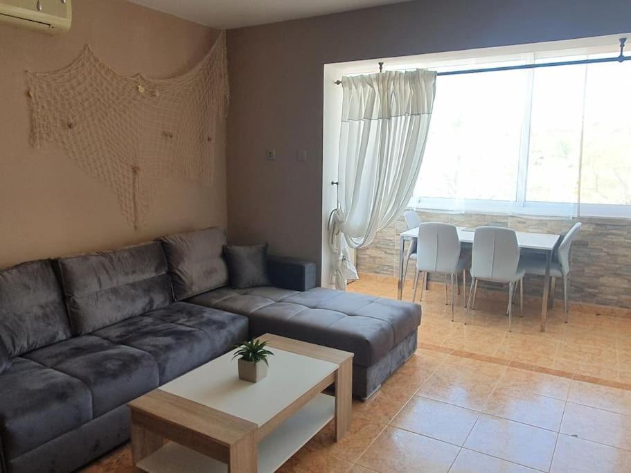 a living room with a couch and a table at Apartment Daniel in Novalja