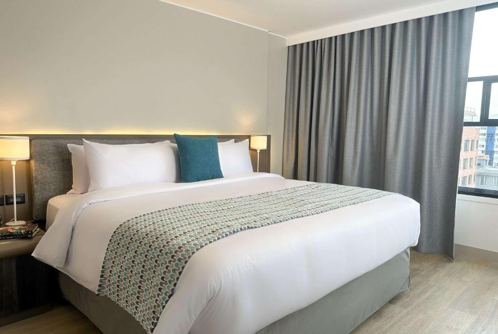 Postel nebo postele na pokoji v ubytování La Quinta by Wyndham Quito