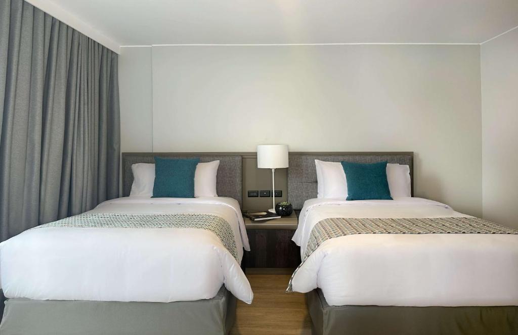 Postel nebo postele na pokoji v ubytování La Quinta by Wyndham Quito