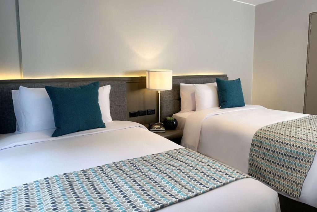 Postel nebo postele na pokoji v ubytování La Quinta by Wyndham Quito