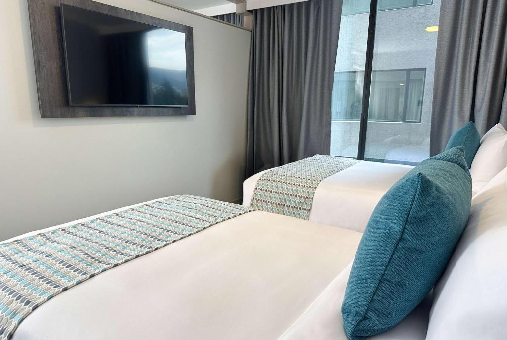 Postel nebo postele na pokoji v ubytování La Quinta by Wyndham Quito