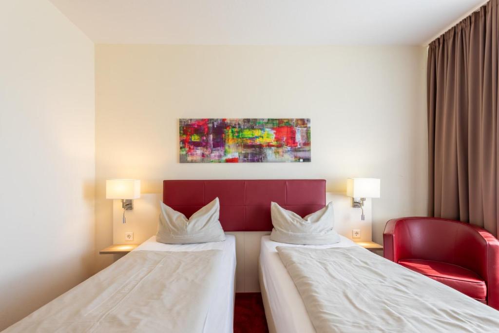 Postel nebo postele na pokoji v ubytování Hotel Montana