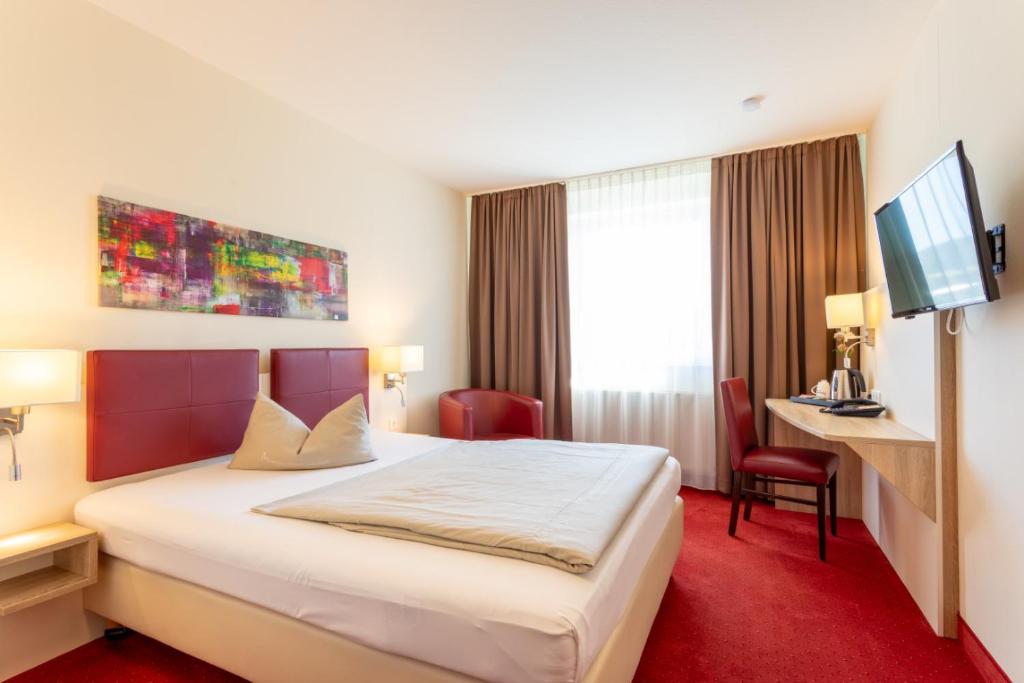 Postel nebo postele na pokoji v ubytování Hotel Montana
